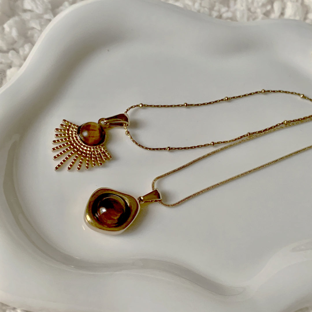 Close-up detail of the Courage Power Tiger Eye Necklace highlighting the unique patterns of the tiger eye stones.