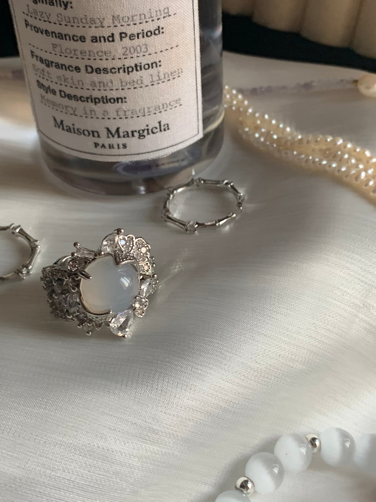 A beautifully crafted white jade ring symbolizing spiritual power and serenity.