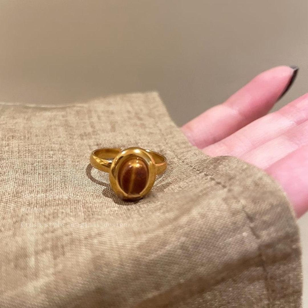 Courage Power Tiger's Eye Gold Ring with a beautifully crafted gold band and striking oval tiger's eye gemstone.