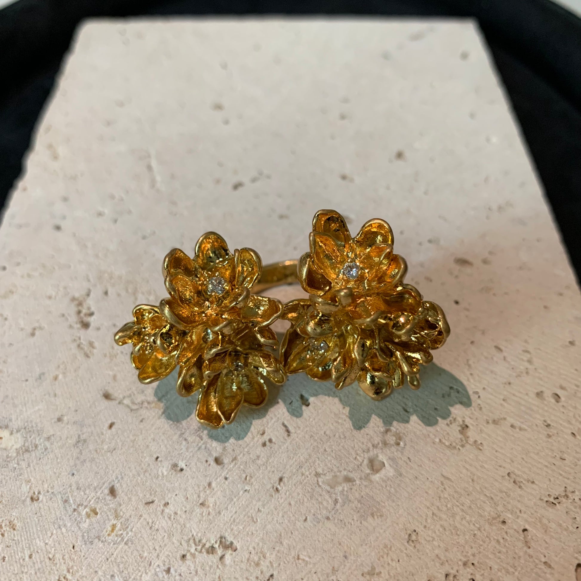 Close-up of the diamond details on the twin blossom ring