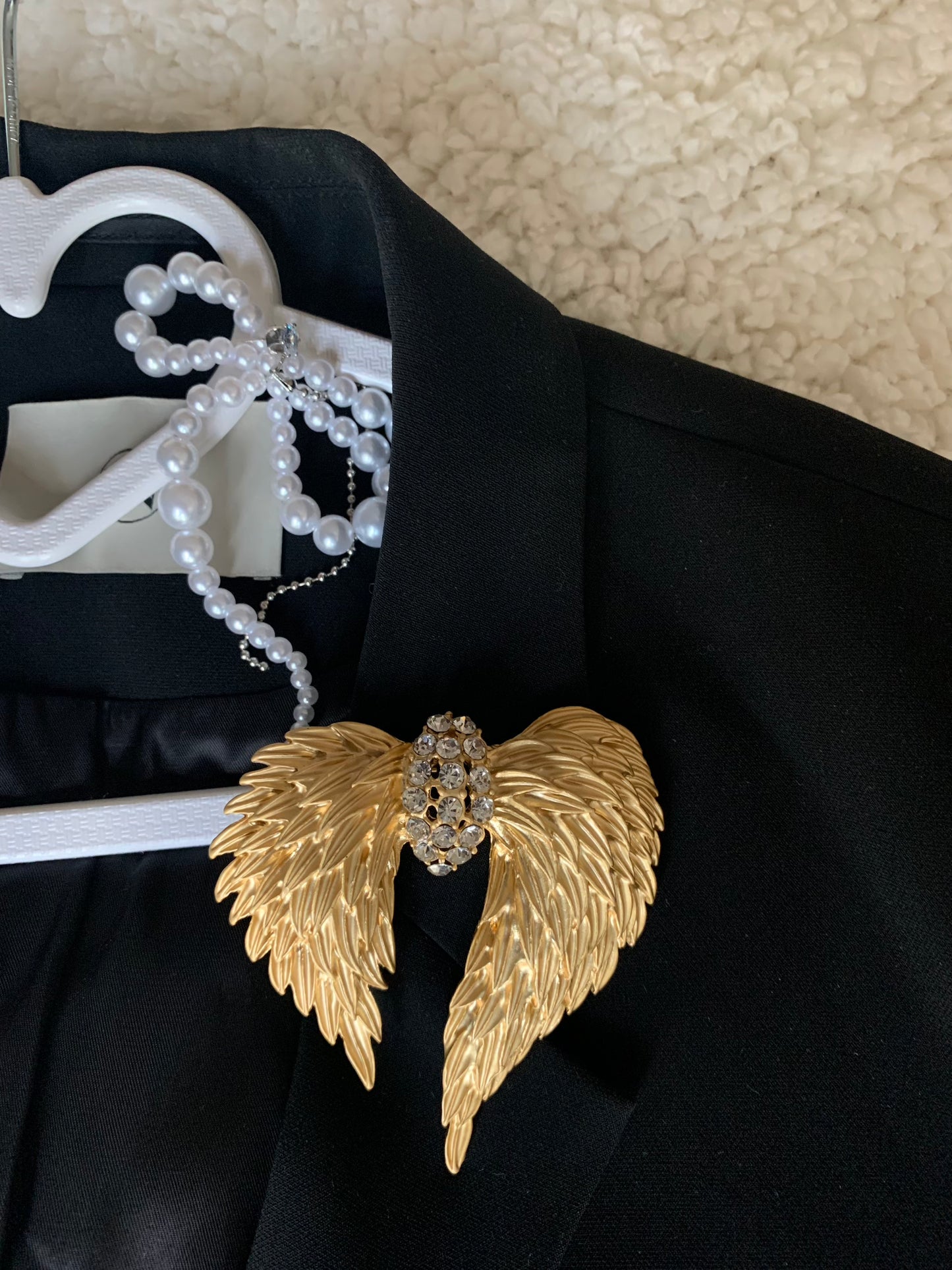 Model wearing the Dream Wings Accessory on a stylish outfit