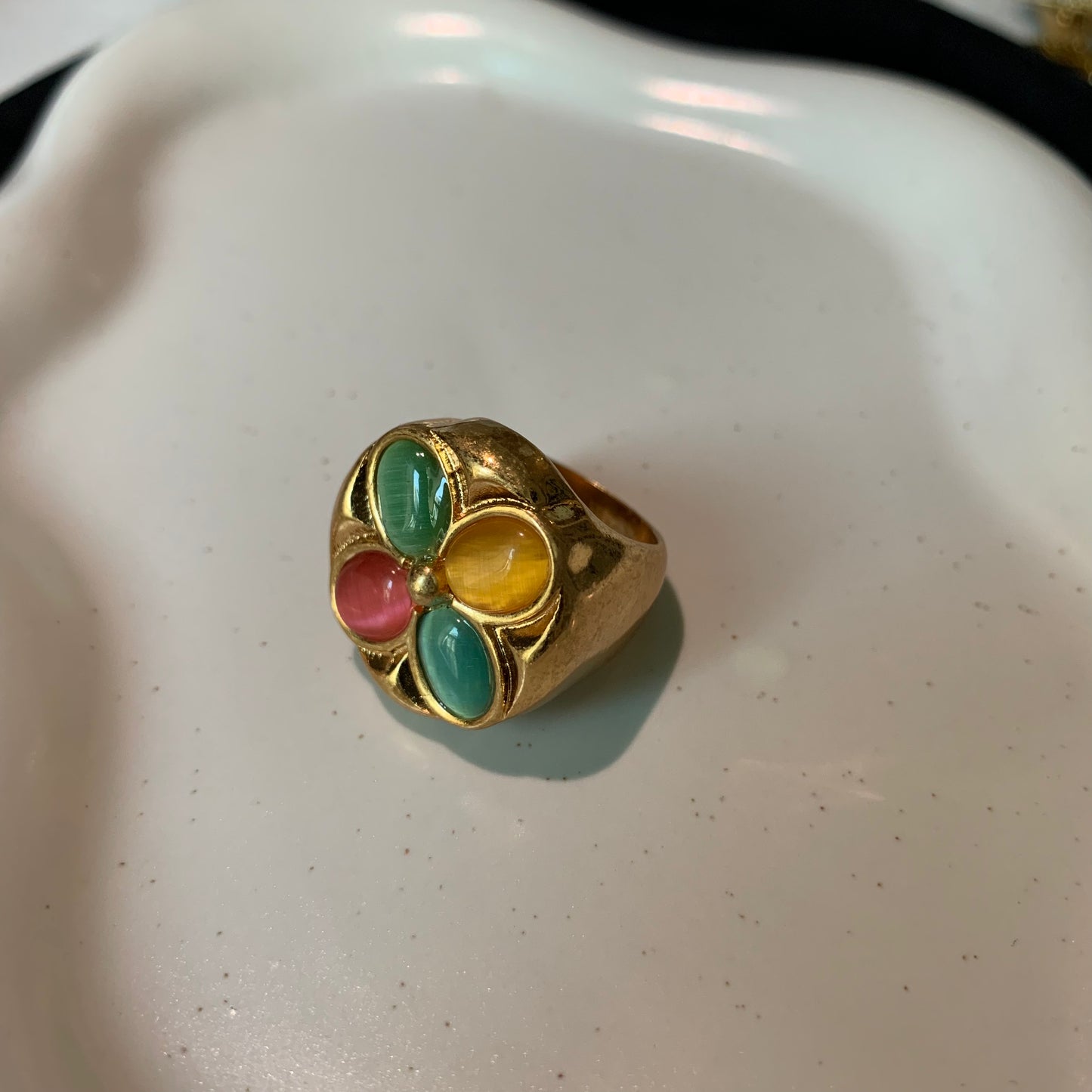 Close-up of the elegant golden ring with a cat's eye stone