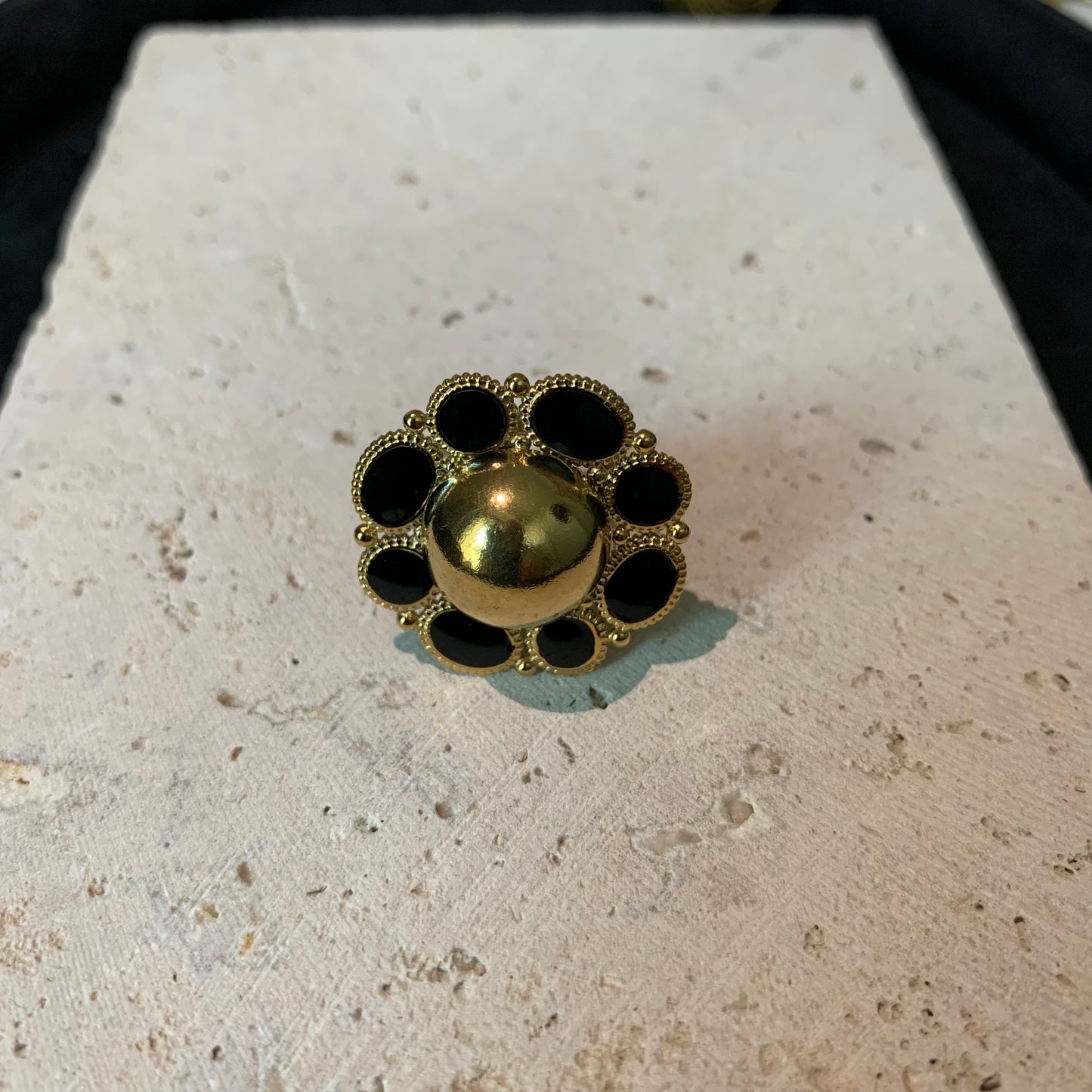 Close-up of the sunflower golden ring from Hope Power, showcasing intricate petal details.