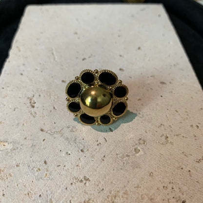 Close-up of the sunflower golden ring from Hope Power, showcasing intricate petal details.