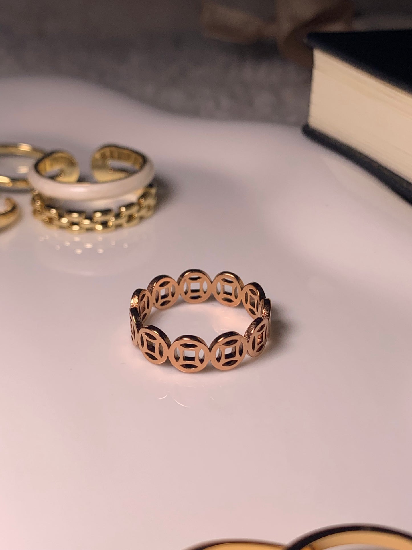 Abundance Power Coins Gold Ring displayed elegantly, symbolizing wealth and prosperity.