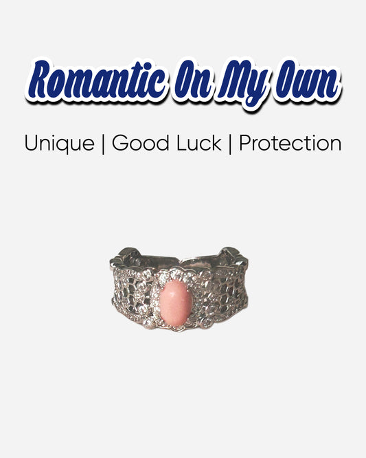Harmony Power Rose Shell Ring symbolizing self-love and empowerment, featuring a pink conch shell centerpiece and intricate lace-patterned band.