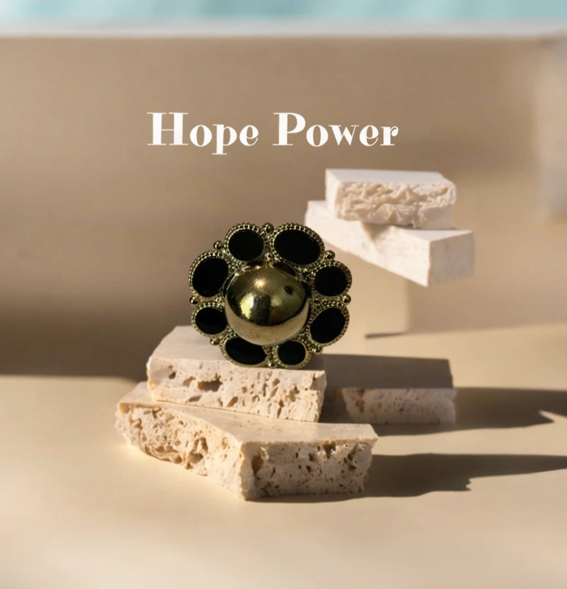 Hope Power Sunflower Golden Ring featuring a beautiful sunflower design in a luxurious gold finish.
