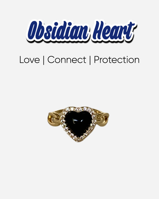Love Power Obsidian Heart Gold Ring featuring a heart-shaped obsidian stone surrounded by sparkling zirconia, set in an 18k gold plated band. Perfect for expressing love and strength.