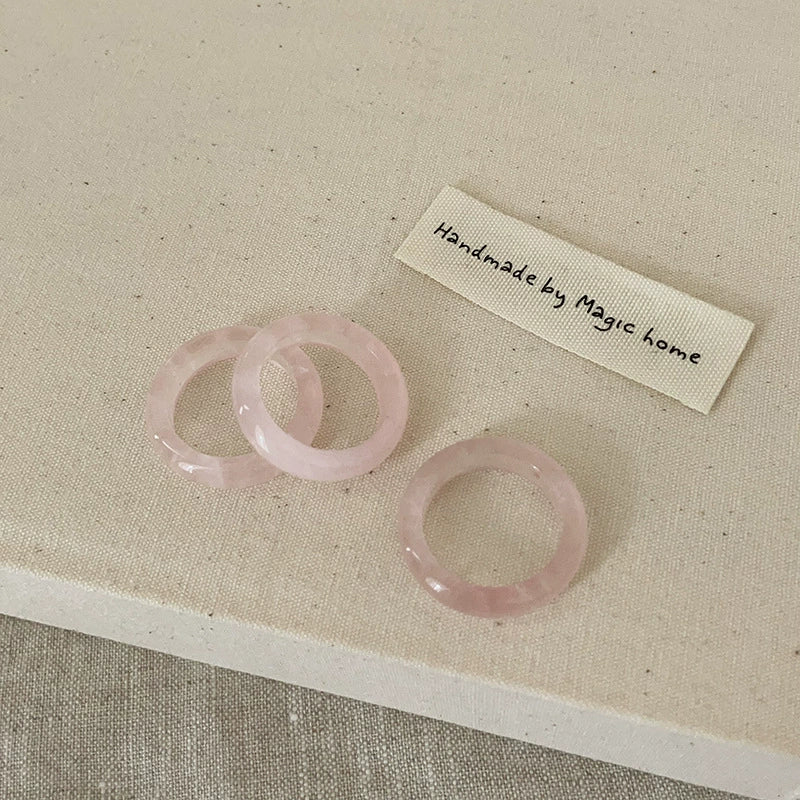 Rose Quartz Ring: A soft pink ring made from rose quartz, symbolizing love and compassion.