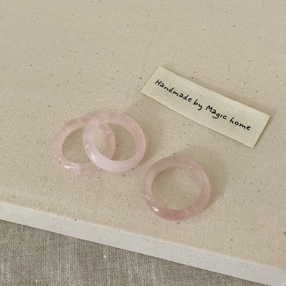 Rose Quartz Ring: A soft pink ring made from rose quartz, symbolizing love and compassion.