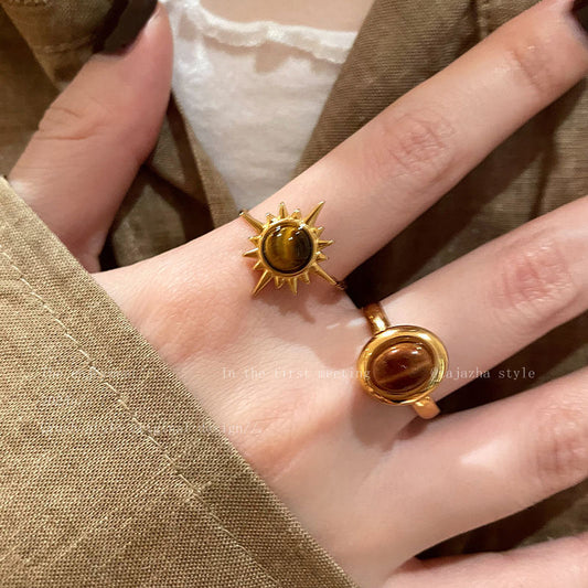Courage Power Tiger's Eye Gold Ring featuring a radiant tiger's eye stone worn on an elegant women's hands.