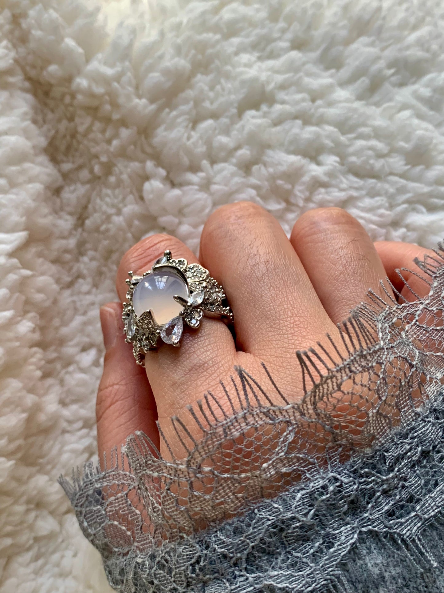 Close-up of model's hand wearing the White Jade Ring.